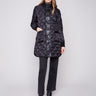 Black quilted puffer jacket featuring rib knit detailing and two front patch pockets by Charlie B.