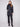 Elegant black puffer jacket with faux leather detailing and snap button front closure by Charlie B.