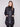 Chic black puffer jacket showcasing two front patch pockets and rib-knit cuffs by Charlie B.