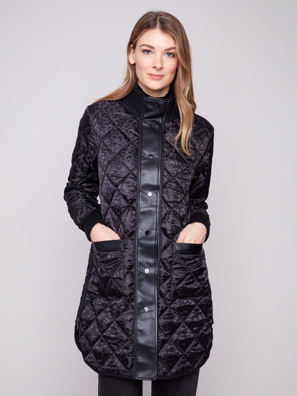 Chic black puffer jacket showcasing two front patch pockets and rib-knit cuffs by Charlie B.