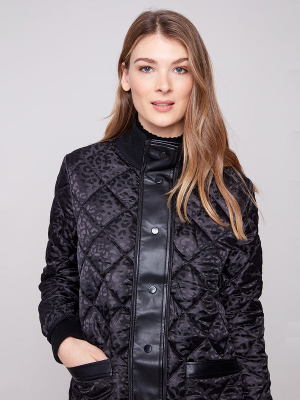 Sophisticated black reversible quilted puffer with sleek snap buttons at the front by Charlie B.