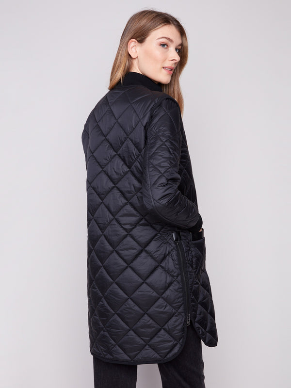 Versatile black quilted jacket featuring stylish side zipper details for added flair by Charlie B.