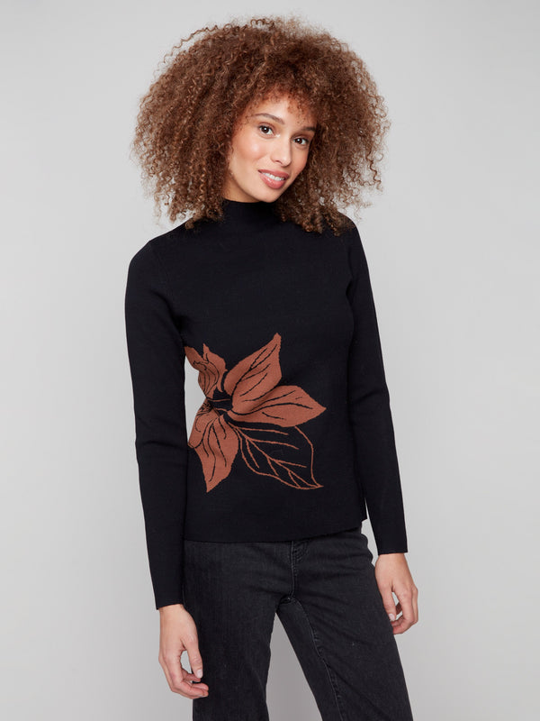 Elegant long-sleeve sweater with reversible design, accented with artistic leaf motif by Charlie B.
