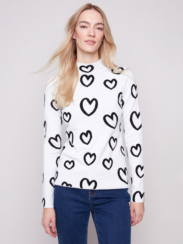 Heart-patterned sweater with a slim fit and cozy mock neck, perfect for versatile styling by Charlie B.
