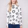 Heart-patterned sweater with a slim fit and cozy mock neck, perfect for versatile styling by Charlie B.