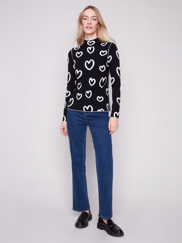 Elegant mock neck sweater with a slimming fit and charming heart design, adding flair to your wardrobe by Charlie B.