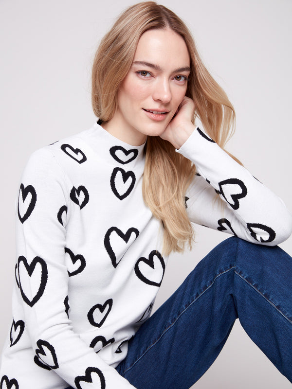 Stylish reversible design in this heart-patterned sweater with comfortable long sleeves by Charlie B.