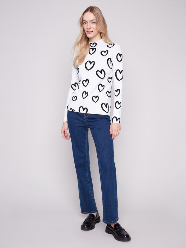 Sophisticated slim-fit sweater adorned with hearts, offering a chic reversible style for added versatility by Charlie B.