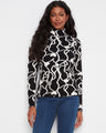Chic reversible top with a stylish mock neck, perfect for versatile wear. The long sleeves add elegance to any outfit. By Charlie B.