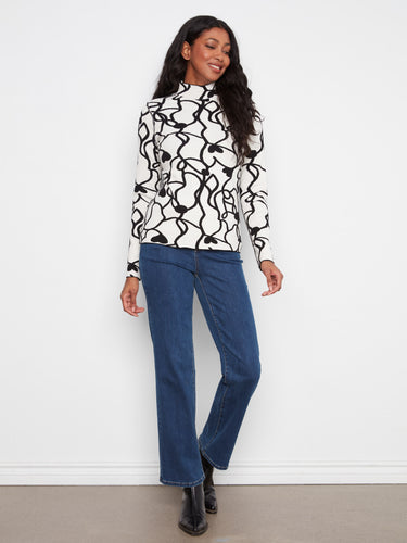 Reversible design offers flexibility in styling while maintaining a chic look with its mock neck and slim fit cut. By Charlie B.