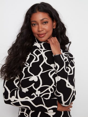 Elegant mock neck top with intricate patterns and long sleeves, designed to enhance your silhouette effortlessly. By Charlie B.