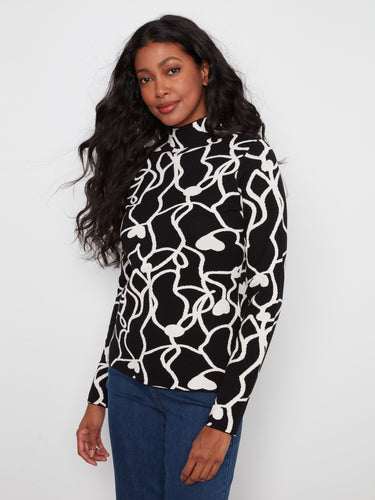 Long sleeve elegance meets modern style in this slim fit top, featuring an eye-catching pattern and versatility. By Charlie B.