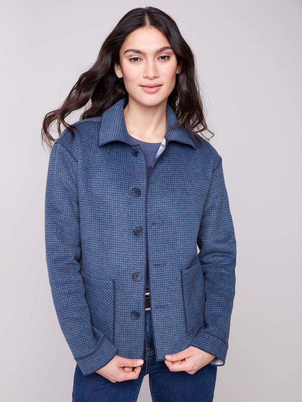 Enjoy the reversible design offering two stylish looks in one chic plaid jacket by Charlie B.