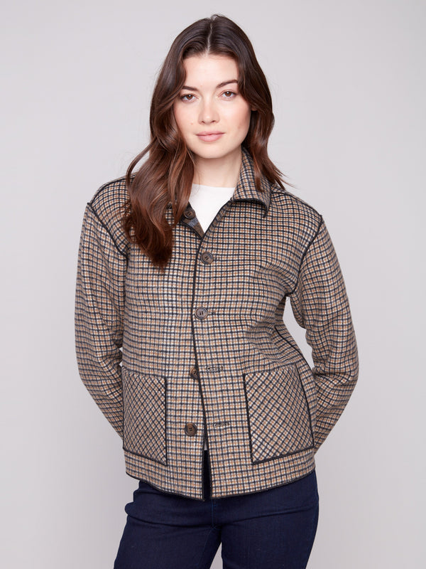 Jacket showcasing reversible design in a stylish plaid pattern by Charlie B.
