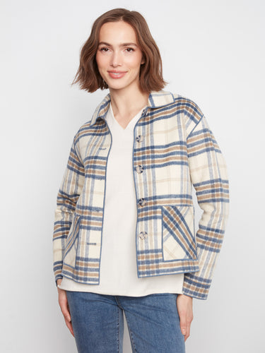 Elegant plaid pattern enhances the charm of this reversible design, making it perfect for varied occasions. By Charlie B.