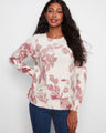 Floral sweater with a classic crew neckline, offering a timeless look and comfortable fit. Perfect for any casual occasion by Charlie B.