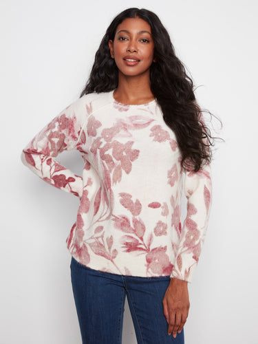 Floral sweater with a classic crew neckline, offering a timeless look and comfortable fit. Perfect for any casual occasion by Charlie B.