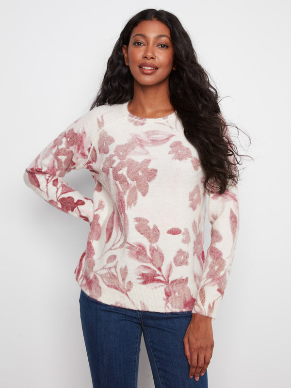 Floral sweater with a classic crew neckline, offering a timeless look and comfortable fit. Perfect for any casual occasion by Charlie B.