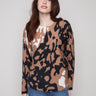 Brown and black spotted plush sweater featuring a crew neckline and frayed edges, perfect for casual outings by Charlie B.