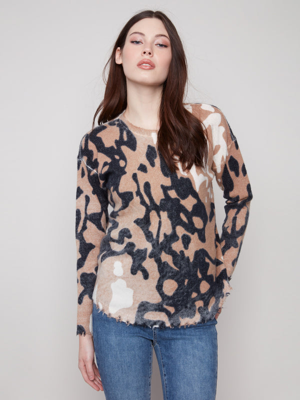 Stylish brown and black spotted sweater with a plush texture, offering comfort and warmth in cooler weather by Charlie B.