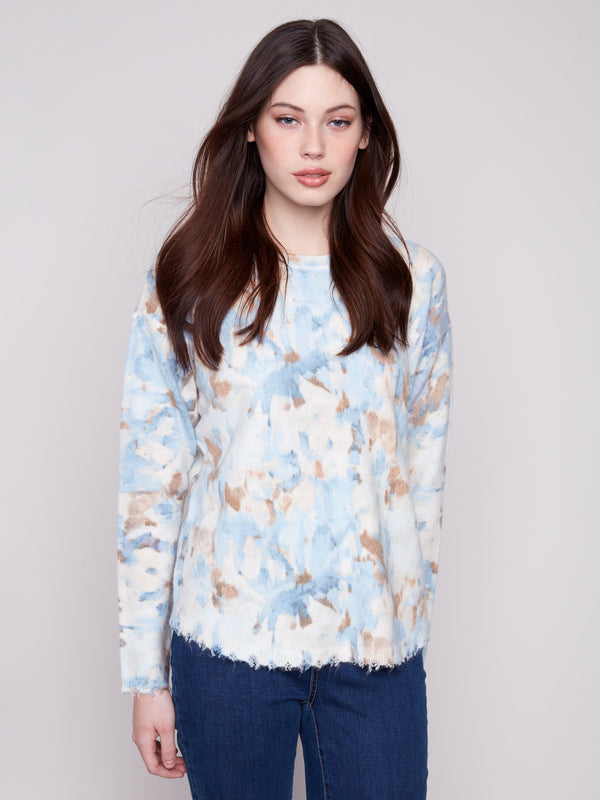 Versatile vapor-colored abstract printed sweater with reversible design, crafted from plush material by Charlie B.