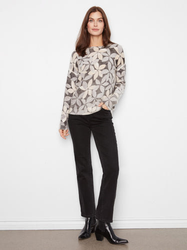 Elegant sweater with reversible design, adorned with dreamy patterns for added charm by Charlie B.