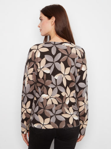 Chic sweater crafted with long sleeves and an eye-catching geometric motif in muted colors by Charlie B.