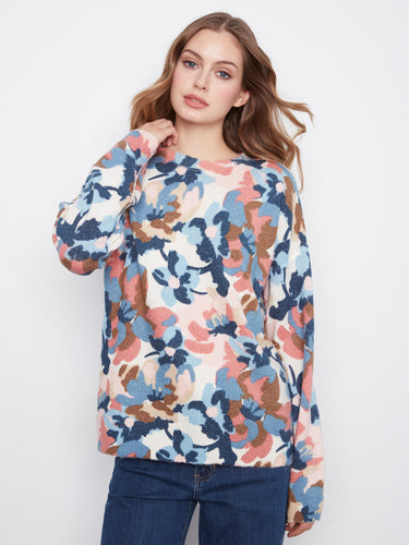The reversible design of this sweater adds versatility to your wardrobe, making it ideal for multiple looks. By Charlie B.
