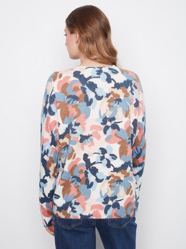 Stay warm in style with the long sleeves of this charming floral-patterned sweater that blends fashion and function. By Charlie B.
