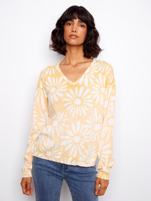This sweater features a stylish V-neck design in a soft yellow floral print, perfect for casual wear. Crafted from 100% cotton by Charlie B.