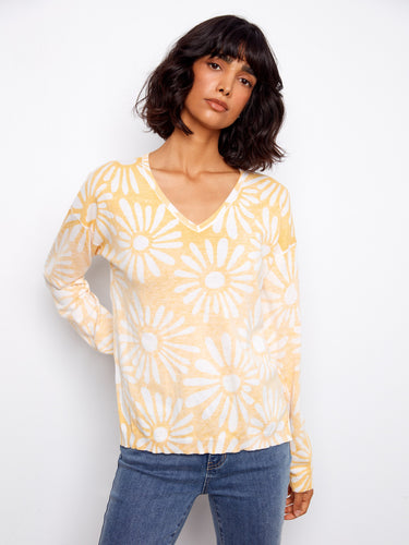 Crafted from 100% cotton, this sweater offers breathability and softness against the skin while showcasing a delightful pattern by Charlie B.