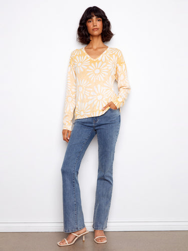 The V-neck style adds elegance to this playful floral print sweater, making it suitable for various occasions. Quality assured by Charlie B.