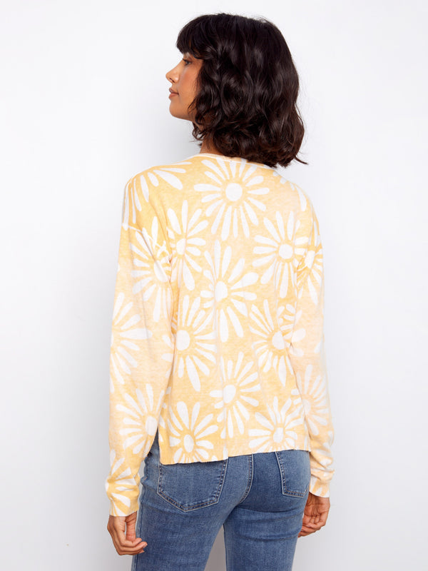 Stay comfortable with long sleeves in this vibrant floral print sweater made from high-quality cotton fabric. A stylish choice brought to you by Charlie B.