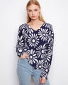 Floral graphic sweater in navy blue and white, showcasing long sleeves. Crafted for style and comfort by Charlie B.