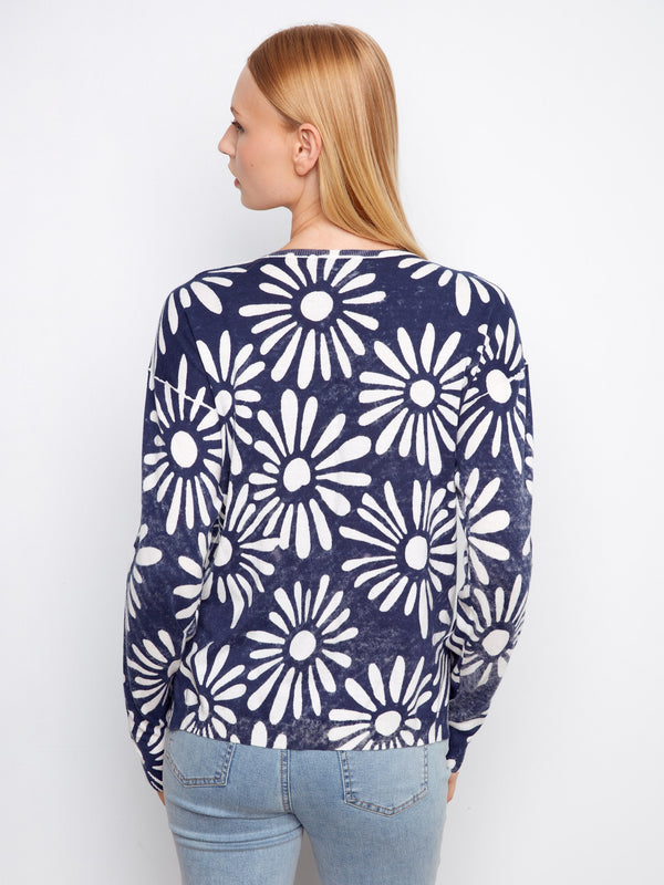 Stylish cotton sweater in navy blue with bold floral graphics. Ideal for casual or dressy occasions by Charlie B.