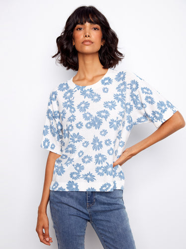 With its reversible design, this floral print blouse provides two looks in one garment—perfect for travel or daily use. By Charlie B.