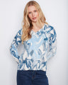 This cotton blend sweater features a stylish V-neck design, perfect for any casual outing. By Charlie B.