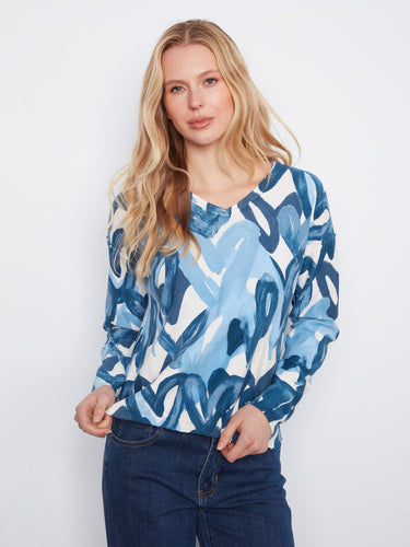 Embrace versatility with this reversible print sweater, offering two looks in one. By Charlie B.