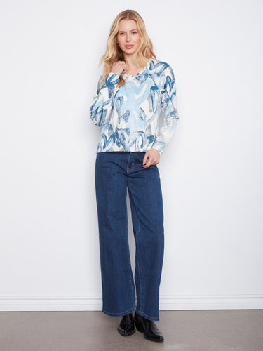Enjoy comfort and style with drop shoulders on this long-sleeved top, ideal for layering. By Charlie B.