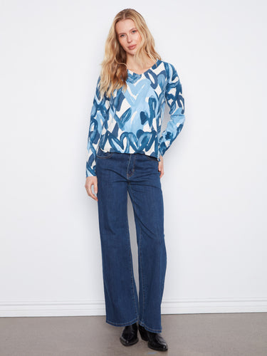Stay cozy in this long-sleeve sweater made from a soft cotton blend fabric. By Charlie B.
