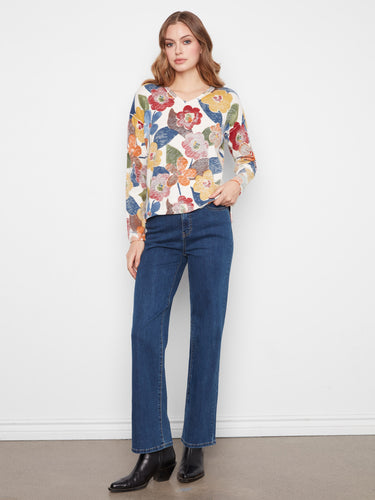Designed with drop shoulders, this floral sweater adds a relaxed and trendy touch to your wardrobe. Embrace effortless style by Charlie B.