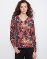 Floral V-neck top featuring a reversible print, perfect for versatile styling. Crafted from a comfortable cotton blend by Charlie B.
