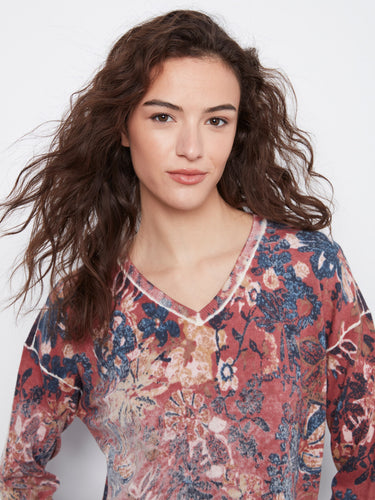 Casual yet elegant drop shoulder design enhances the laid-back appeal of this charming floral V-neck top by Charlie B.
