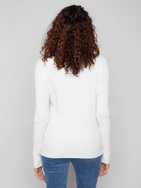 Stylish ecru knit with long sleeves, offering both warmth and elegance by Charlie B.