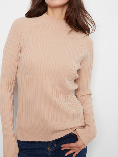 This ribbed knit texture offers a cozy and chic feel, making it an essential addition to your wardrobe. By Charlie B.