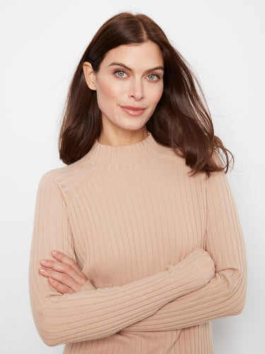 Long sleeves provide warmth and versatility in this stylish sweater, ideal for layering or wearing alone. By Charlie B.