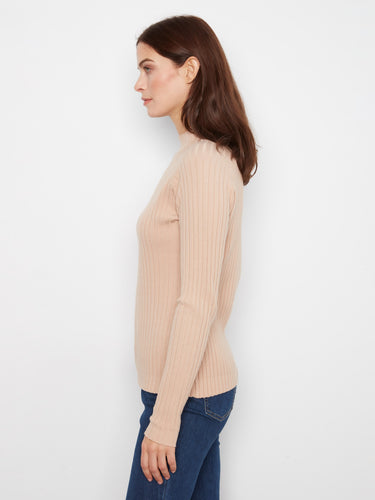 Mock neck enhances the classic appeal of this piece, combining fashion-forward design with comfort. By Charlie B.
