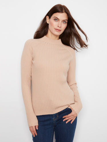 Ribbed knit texture adds depth and dimension to this versatile piece, perfect for various styles. By Charlie B.