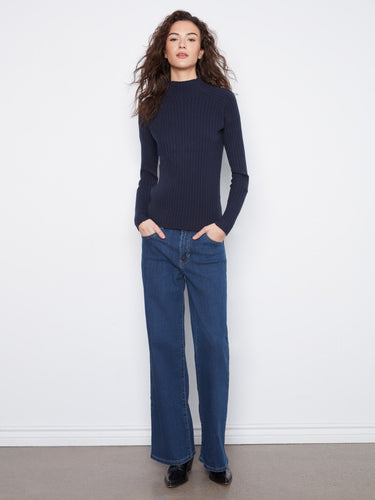 This stylish navy sweater is crafted in a slim fit, accentuating the silhouette beautifully. Designed by Charlie B.