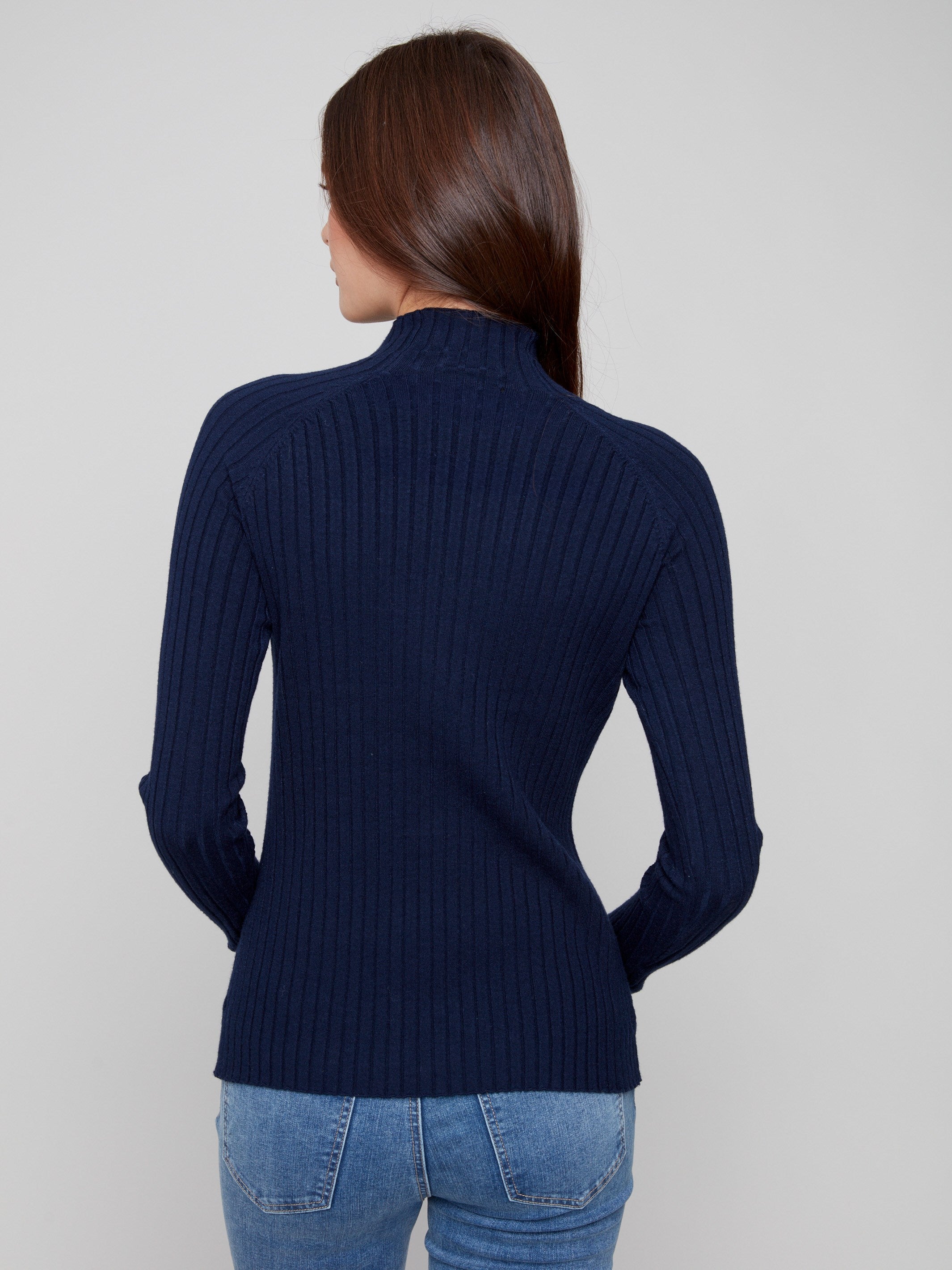 Sophisticated navy sweater showcasing a flattering slim fit and ribbed texture by Charlie B.